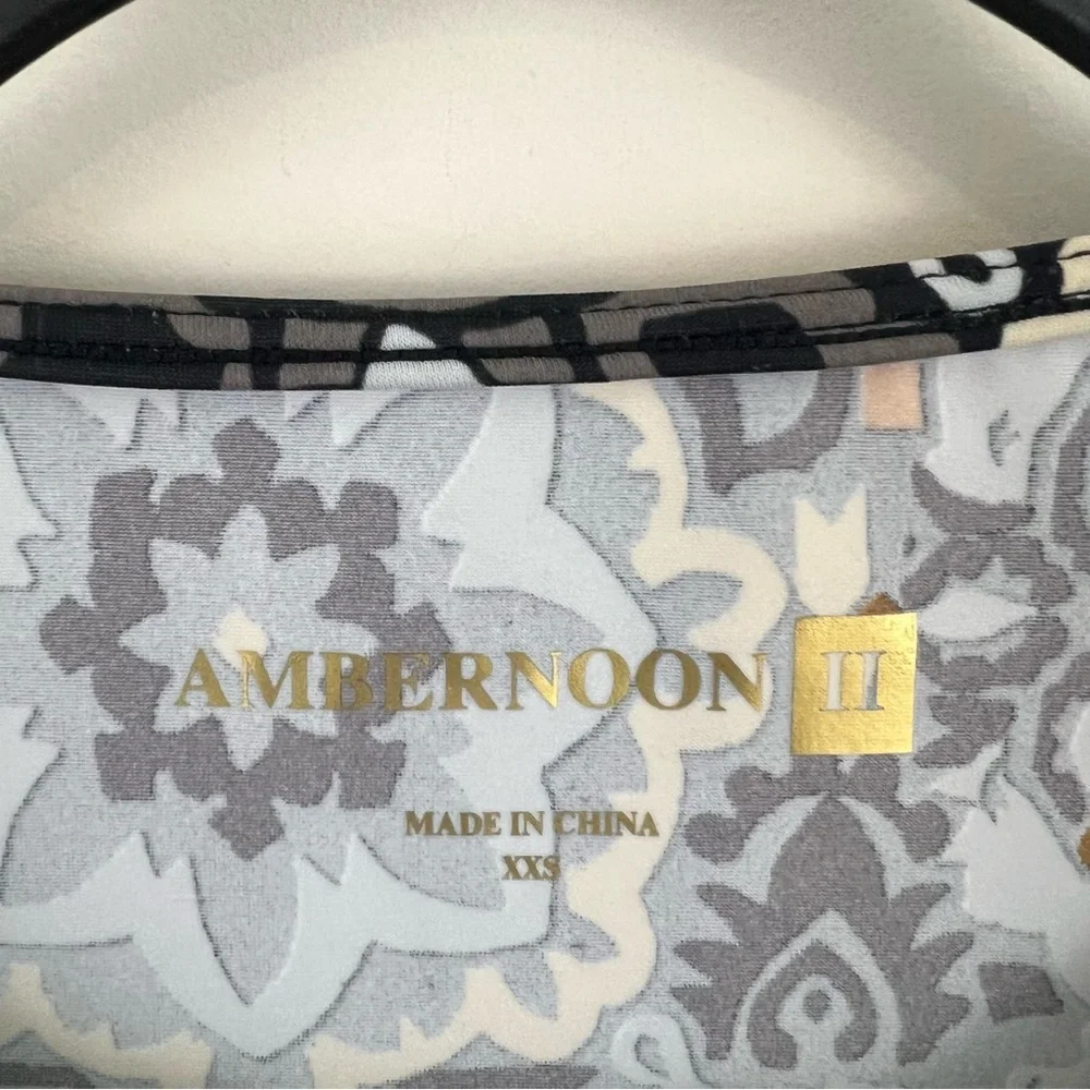 Ambernoon II by Dr. Erum Ilyas Floral Print 1/4 Zip Roll Tab Sleeve Rash Guard